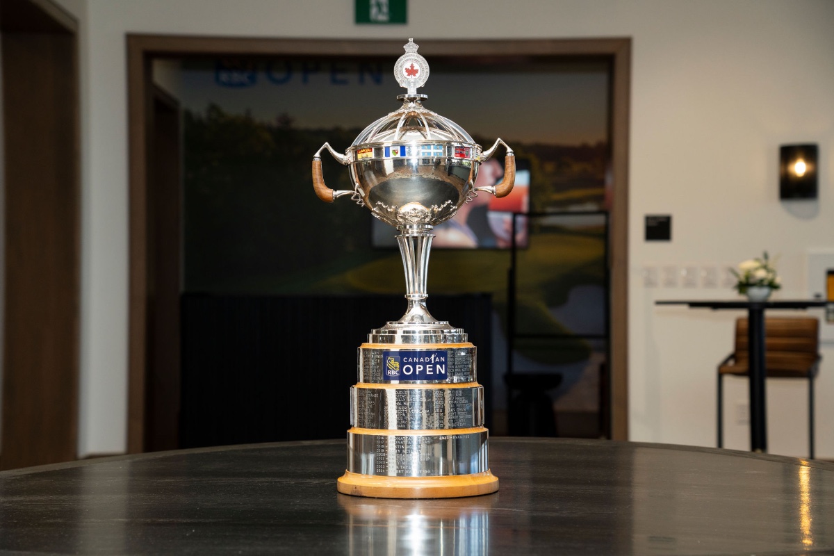 The historic silver RBC Canadian Open championship trophy with engraved winners' names displayed on a wooden base in the clubhouse, sports photography by Toronto photographer Quinton Meyer